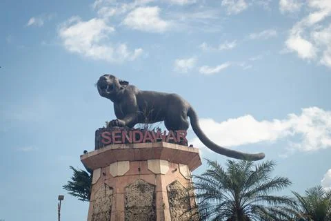 Statue of the "Macan Dahan" figure (clouded leopard of borneo). Stock Photos