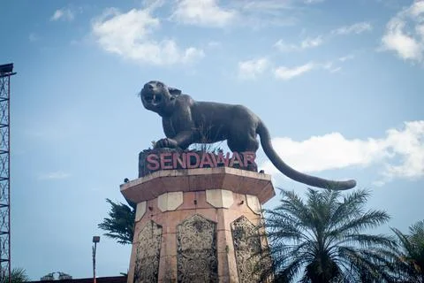 Statue of the "Macan Dahan" figure (clouded leopard of borneo). Stock Photos