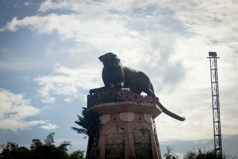 Statue of the "Macan Dahan" figure (clouded leopard of borneo). Stock Photos