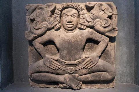 Statue of a man sitting on the ground Stock Photos