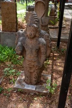 A statue of a man is sitting on a stone base. in Chennai Stock-Fotos