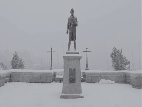 Statue of Man in Winter Snow Storm Victoria BC Canada Stock Footage 77977775