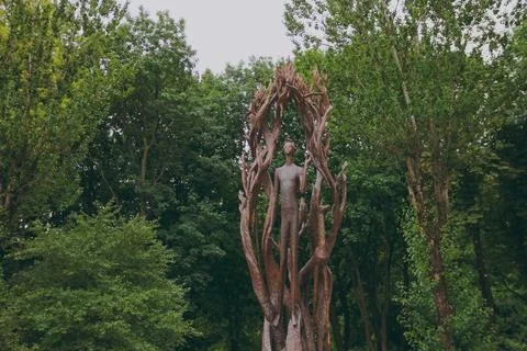 Statue of a man in the woods Stock Photos