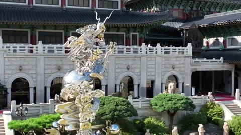 A statue of a metal dragon in a temple Stock Footage 306033937