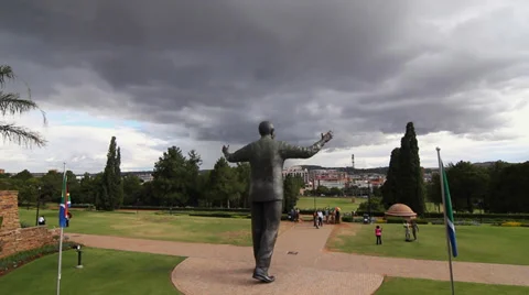 Statue of Nelson Mandela with storm clouds Stock Footage 35394601