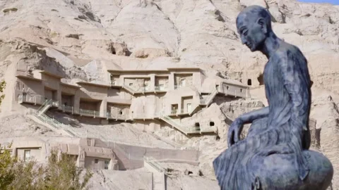 Statue next to the grotto in Xinjiang Stock Footage 235106931
