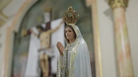 Statue of Our Lady of Fatima praying with crown in church Stock Footage 337581037