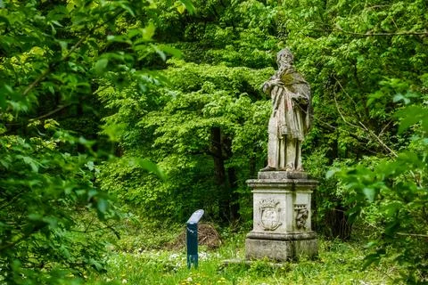 Statue on a pedestal of a saint of a monastery Foto stock