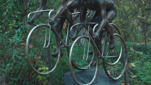 Statue people on bycicles from the front Stock Footage 166634772