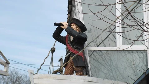 A statue of a pirate, a pirate looking through a telescope. Odessa Ukraine Stock Footage 103332660