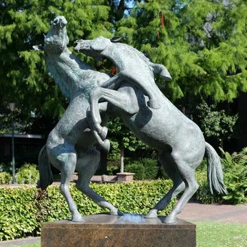 Statue with playing horses Stock Photos