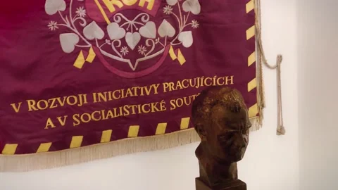 Statue on red communist flag  Stock Footage 134938311