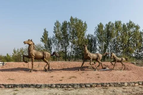 A statue of running horses Stock Photos
