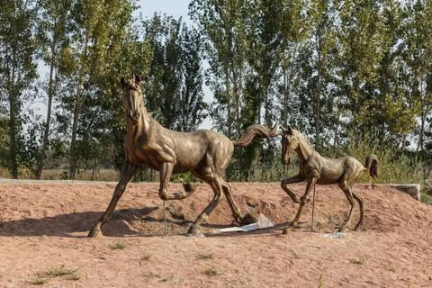 A statue of running horses Stock Photos