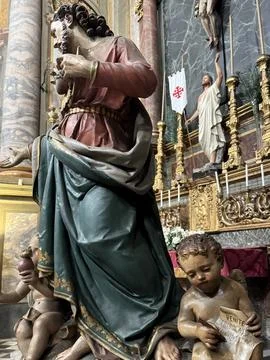 Statue of Saint and Angel Inside Italian Baroque Church. Stock Photos