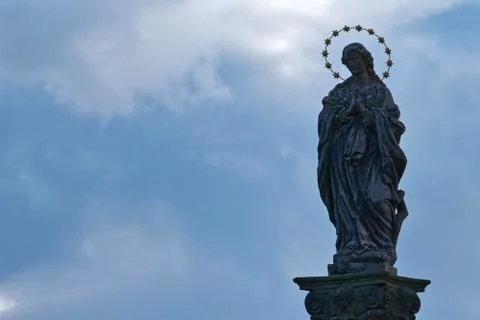 Statue of saint with cloudy background 스톡 사진