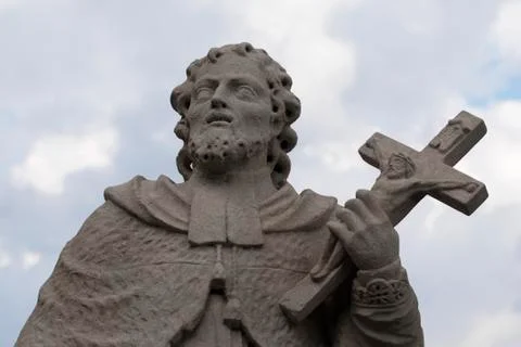 Statue of saint with cross Stock Photos