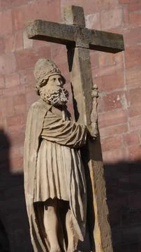 Statue of a saint with cross Stock-Fotos