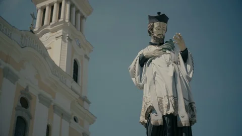 Statue Of Saint John Of Nepomuk In Front Of Maria Radna Monastery. Bottom Up. Stock Footage 86056443