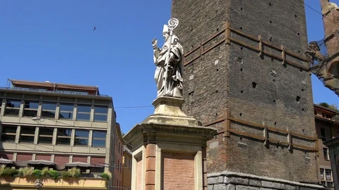 Statue of Saint Petronius in front of two towers of Bologna, Itay Stock Footage 93592152
