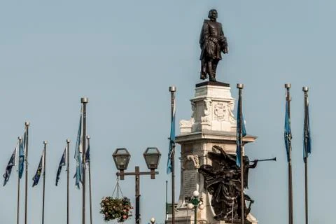 Statue of Samuel de Champlain against blue summer sky in historic area founde Stock Photos