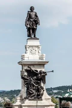 Statue of Samuel de Champlain against blue summer sky in historic area founde Stock Photos