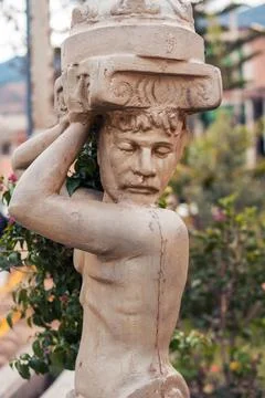 Statue in the shape of an old man Stock Photos