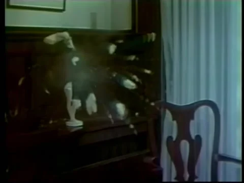 Statue on shelf exploding in slow motion | Stock Video | Pond5