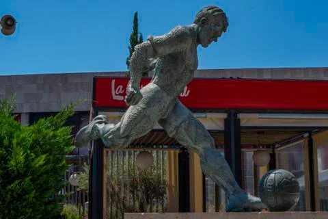 A statue of soccer player Stock Photos