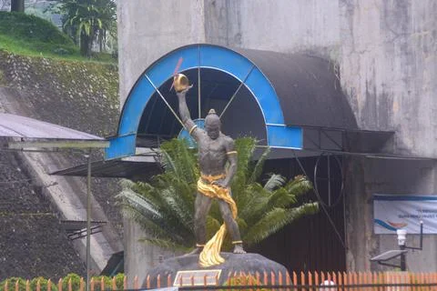 A statue stands on the side of the road, Wonosobo Indonesia.. Stock Photos