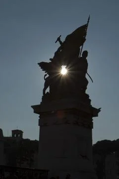 Statue with sun Stock Photos