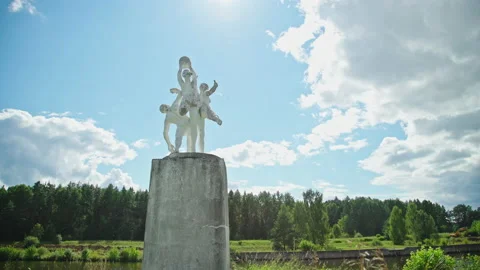 Statue of three people playing ball back. Soviet art Video stock 157726685