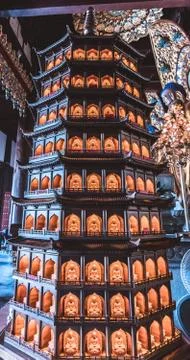 Statue of a trditionalasian pagoda with lightning windows Stock Photos
