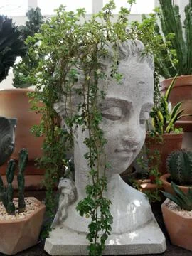 The statue of a tree-haired man For decorating the garden to look beautiful Stock Photos