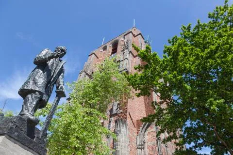 Statue of troelstra next to oldehove tower in the centre of leeuwarden in the Stock Photos