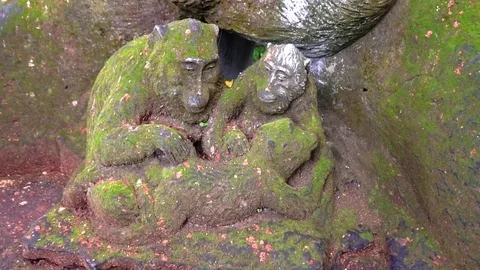 Statue of two faces and monkey in Bali Stock Footage