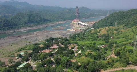 Statue of Unity Standing Tall Amidst Green Hills | Aerial Descending View Stock Footage 152211188