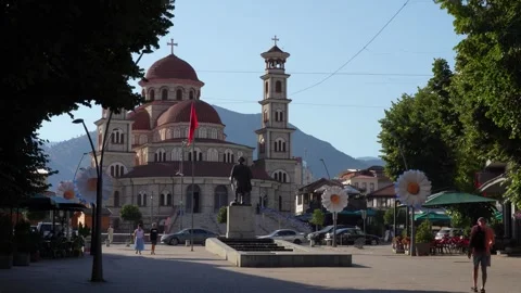 Statue of unknown soldier and Resurrection Cathedral in Korça on morning Stock Footage 344907068
