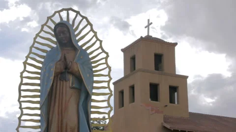 A Statue of the Virgin Guadalupe in Front of a Mexican Catholic Church Stock Footage 64836708