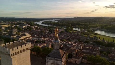 Statue of the Virgin Mary top of Notre-Dame des Doms Cathedral in Avignon Stock Footage 341841599