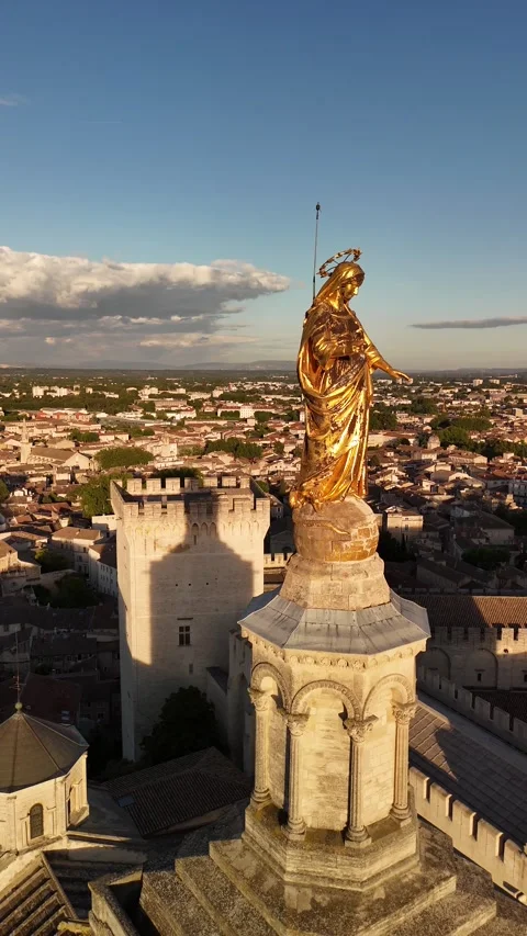 Statue of the Virgin Mary top of Notre-Dame des Doms Cathedral in Avignon Stock Footage 341841841