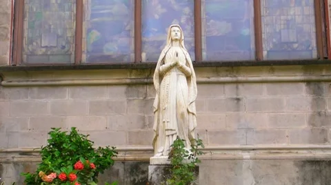 Statue of Virgin Mary in very old church Stock Footage 7746016