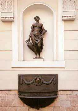 Statue in a wall niche in Riga Stock Photos