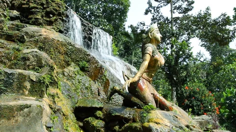Statue in waterfall in jungle Stock Footage 34463754