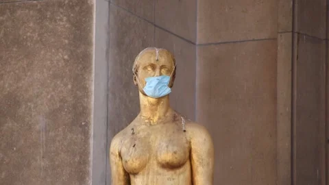 A statue wears a mask after the lockdown in Paris Stock Footage 130698606