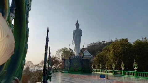 Statue of a white Buddha standing elegantly Stock Footage 264075790