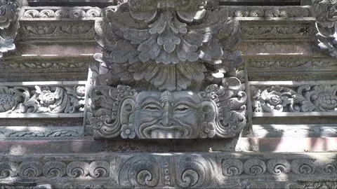Statues and Bas Relief Carving on Temple Wall, Bhoma Face, Kuta, Bali, Indonesia Stock Footage 304630541