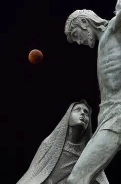 Statues and eclipse of the Moon Stock Photos