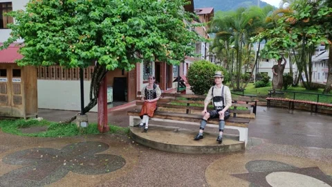 Statues of an austrian man and austrian woman in the city center of Pozuzo, Peru Stock Footage 283230461