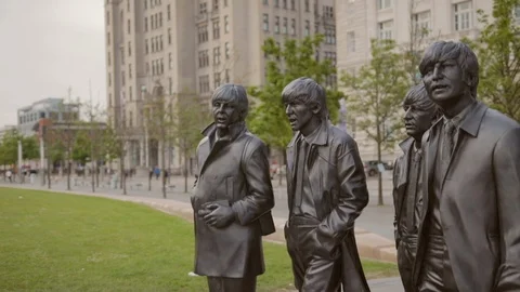 Statues of The Beatles Paul John Ringo and George in Liverpool Video stock 115325717